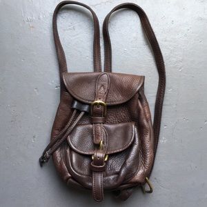 Small leather backpack with buckles